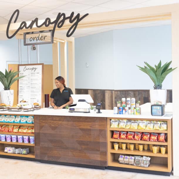Woman working at the Canopy Level Two dining option at the Texas State Aquarium