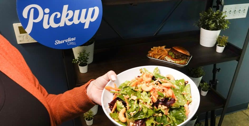 Food from a mobile order being picked up at Texas State Aquarium's Shoreline Grill