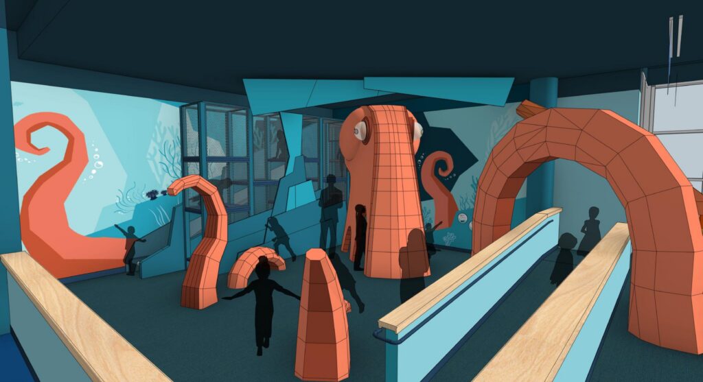A room features large, orange, geometric octopus tentacles rising from the floor, with children interacting and playing around them; ocean-themed murals decorate the blue walls.